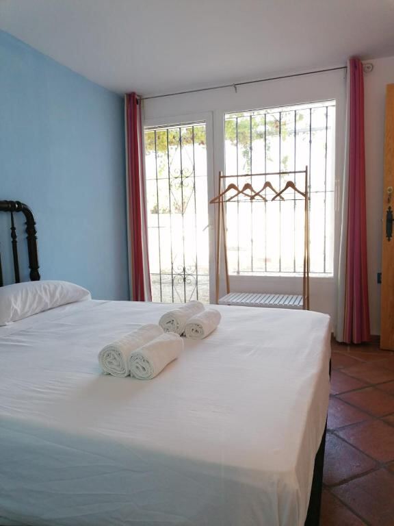 Bright guest room with double bed and garden access